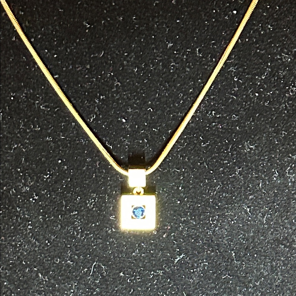 Nina Ricci elegant Gold Necklace with Blue Gemstone